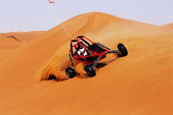 Experience exhilarating rides over golden dunes carving through soft sand with friends or family. Unleash your adventurous spirit and explore the stunning beauty of the Arabian desert landscape.